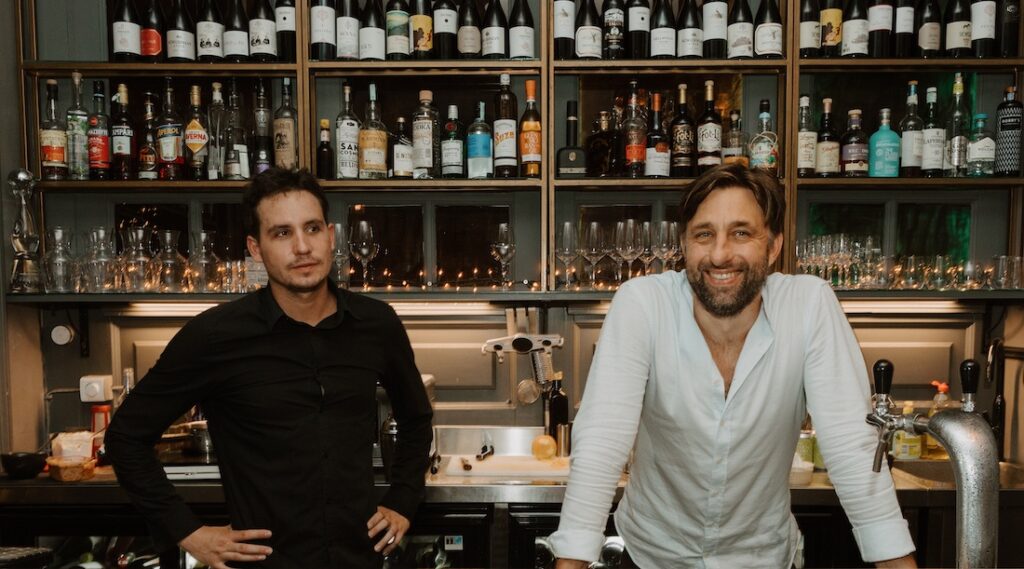 Kristóf and Mark, the owners of Parlé behind the bar